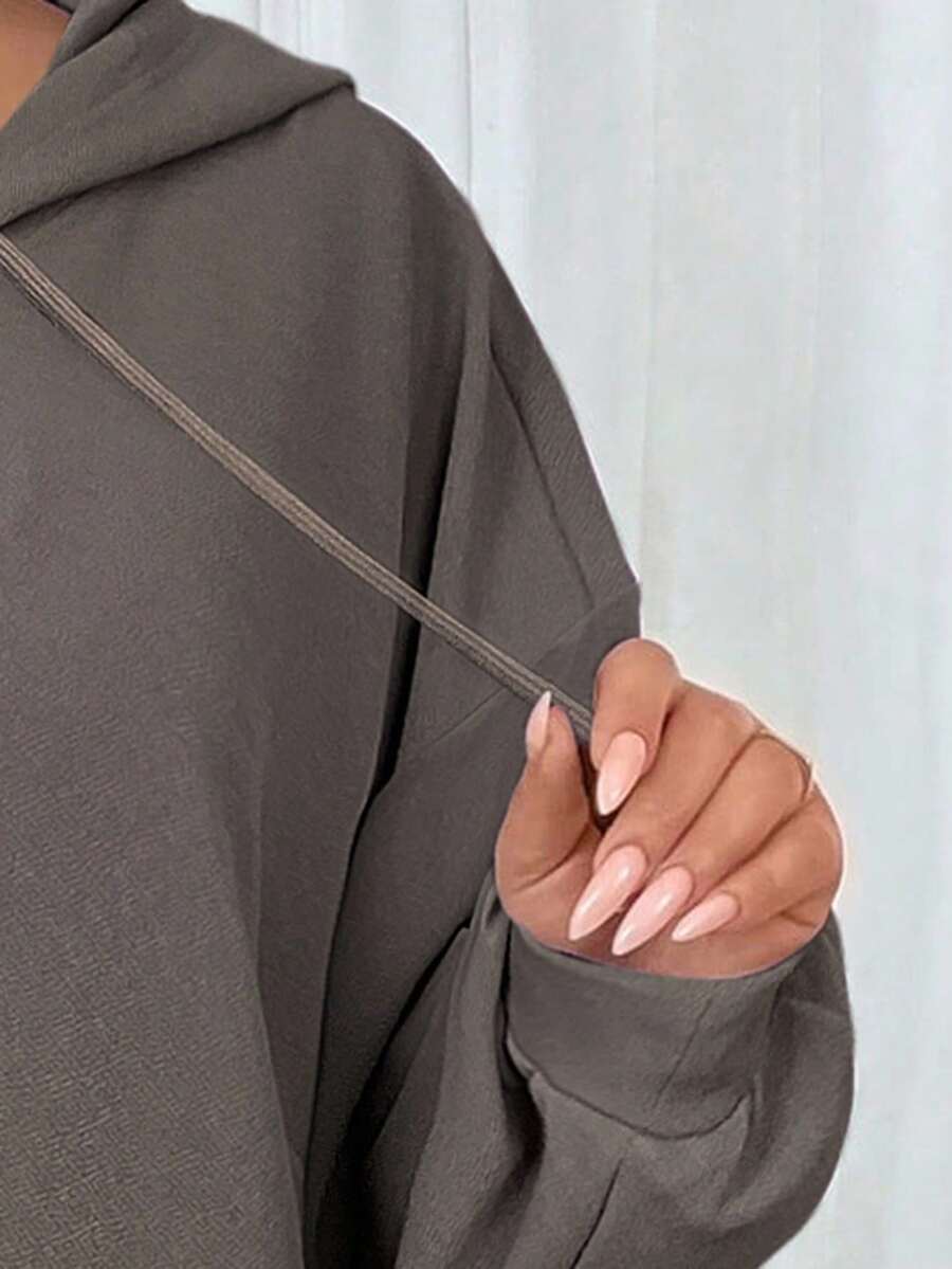 SHEIN CURVE+ Plus-size dames casual sport losse hoodiejurk met gebogen zoom, herfst/winter - Tout Pour Vous